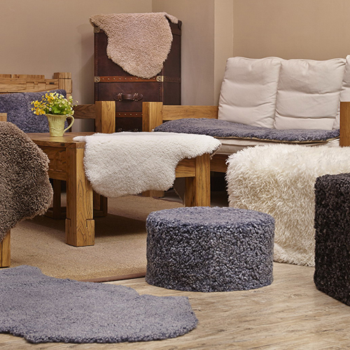 Sheepskin rugs, decorative pillows, ottoman and seat cushion
